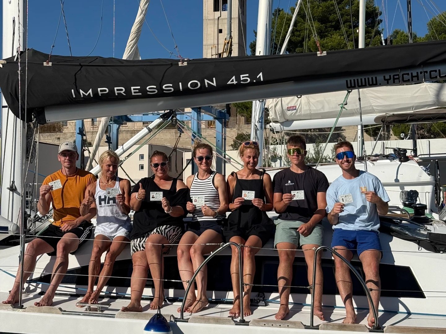 Crew with sailing licenses on board in the harbor